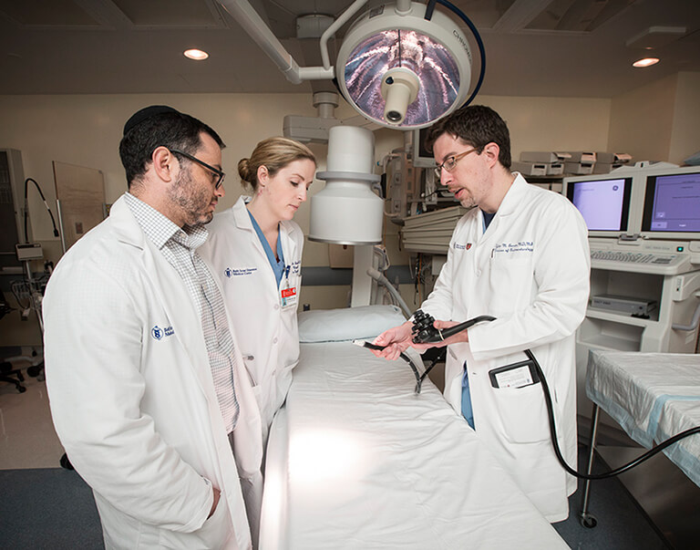 Doctors talking in operating room