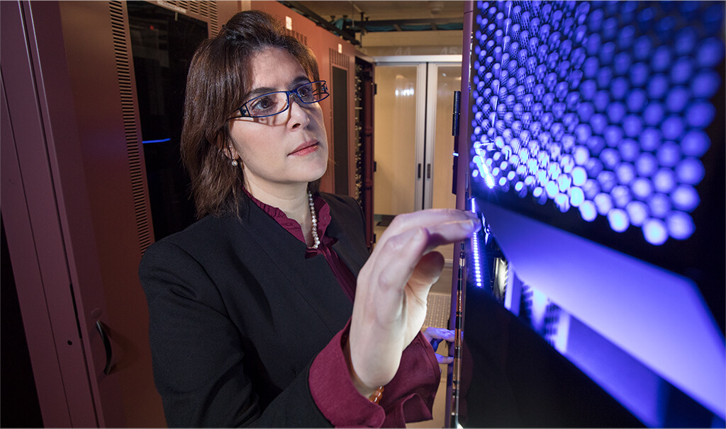 Business woman inspecting computer banks