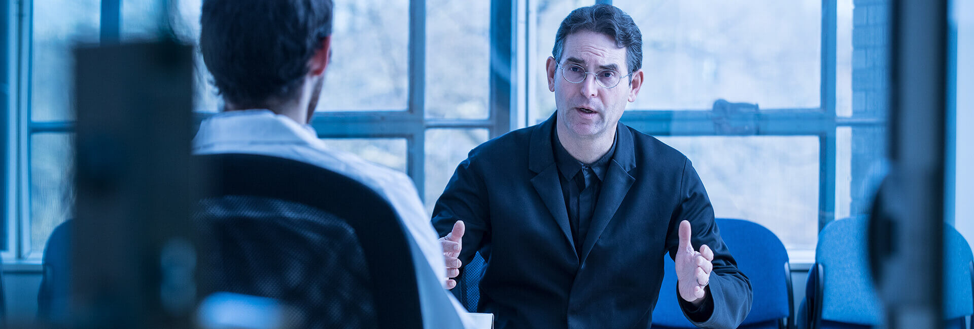 John D. Halamka, M.D. in business meeting