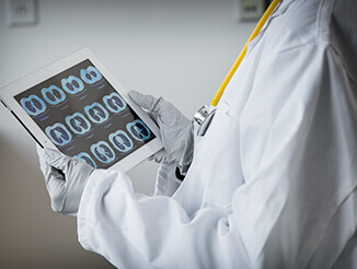 Lab worker holding tablet