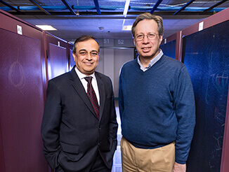 Two businessmen in office hallway